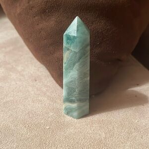 Stone tower in green and white